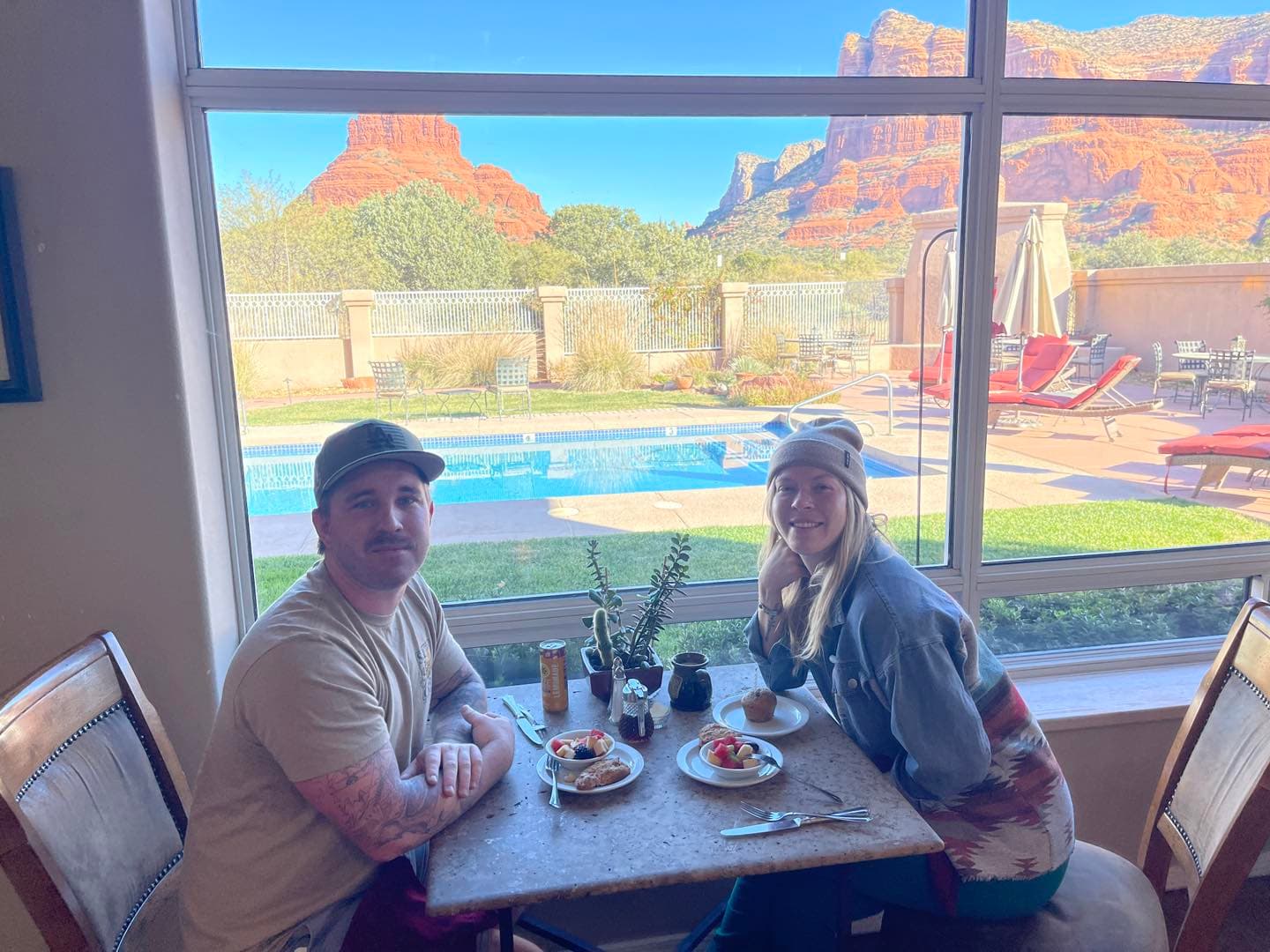 couple having breakfast in front of gian picture window